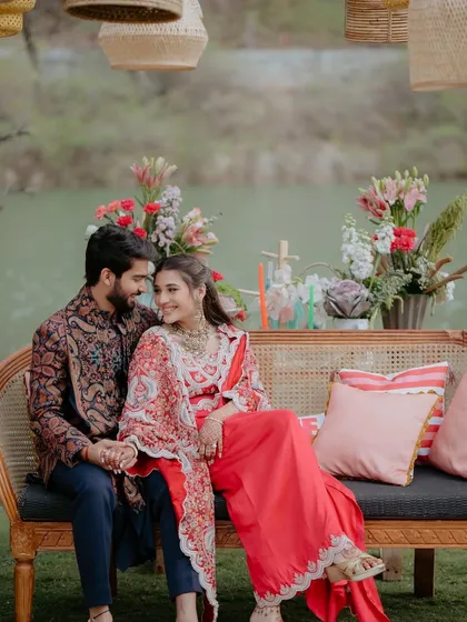 A romantic shot of the couple seated in one of our curated lounge areas by the lake.