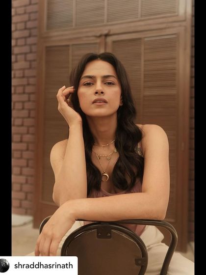 A closer portrait of Shraddha, focusing on the beautiful details of the layered necklaces and her confident, direct gaze.