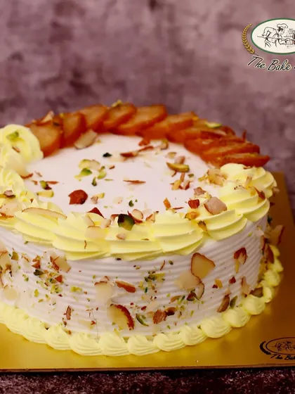 Another beautiful presentation of our Gulab Jamun Cake, garnished with nuts and ready to be the star of your celebration.