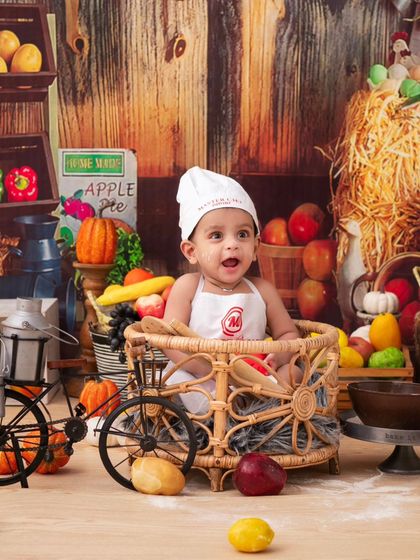 A happy little chef with his bicycle cart. The props I provide are designed to be interactive and fun for the children.