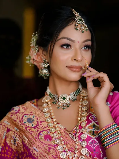 Graceful and pink, fit for royalty. Another beautiful portrait of the Gujarati bride.