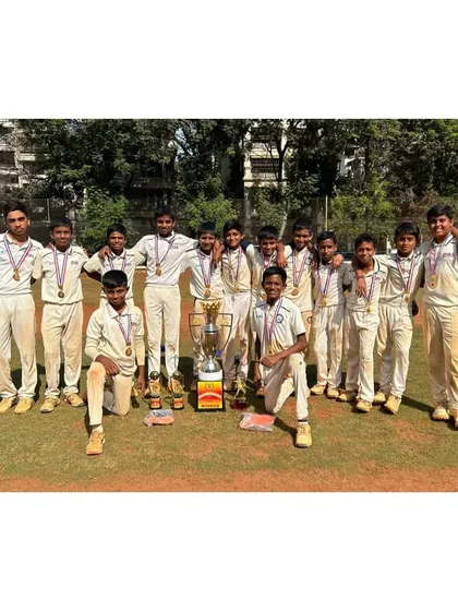 Our victorious U-13 team posing with the Amateur Cup trophy. A well-deserved win for these hardworking boys.