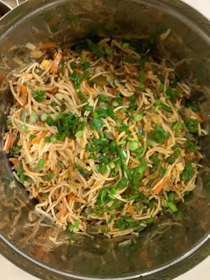 A big bowl of freshly tossed Hakka Noodles with plenty of vegetables.