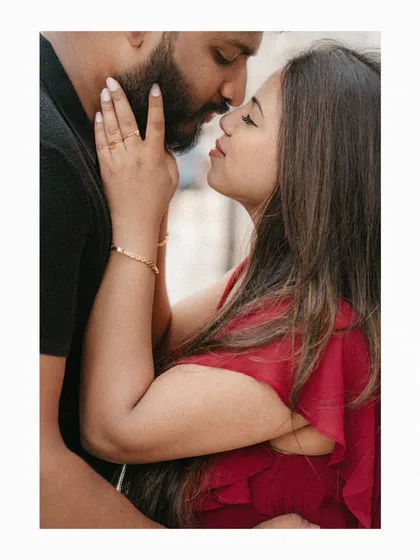 A tender moment between Akhil and Merlin. This close-up from their London pre-wedding shoot focuses on the gentle touch and near-kiss, highlighting the deep affection and romance of their story.