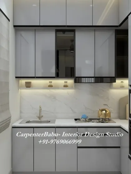 A compact and efficient kitchen with glossy grey cabinets and a white marble backsplash. The design makes the most of a smaller space without compromising on style or functionality.