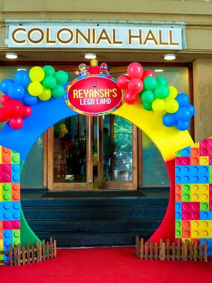 The entrance to "Reyansh's Lego Land," featuring a colorful brick arch and large LEGO character figures.