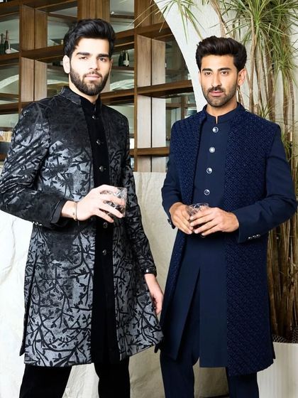 A duo of dark, elegant kurtas perfect for a wedding reception or festive gathering. The intricate details in both the black and navy ensembles speak volumes.