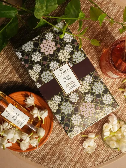 The intoxicating scent of Fresh Mogra is a wedding favorite. Here, our fragrance reed diffuser set is shown with its elegant packaging, making it a sophisticated and practical gift for your guests to take home.
