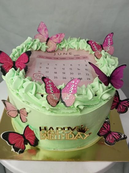 A third view of the pretty calendar cake with butterflies.
