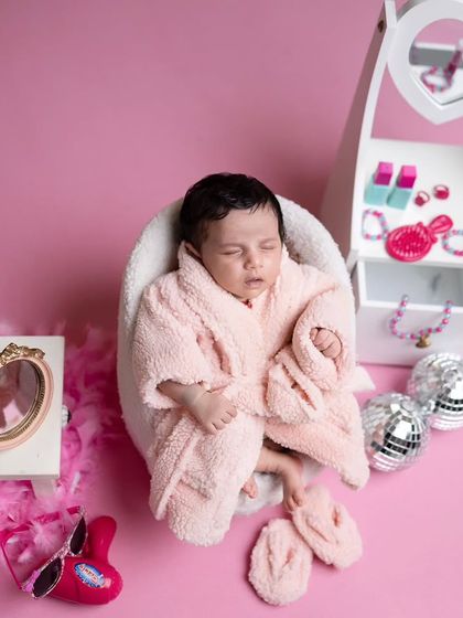 A slightly different pose for our spa baby, capturing her in a moment of deep, relaxed sleep.