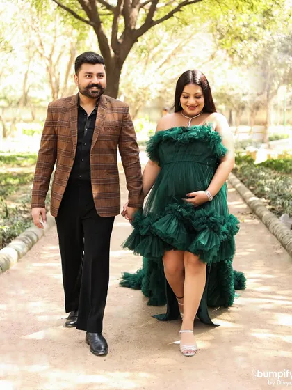 The happy couple walks hand-in-hand, sharing a smile. These candid, walking shots add a sense of movement and joy to the photo gallery.