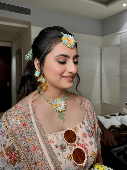A closer look at Palak's Haldi makeup. The soft, glowing skin and subtle pop of color on the eyes create a look that is both playful and elegant.