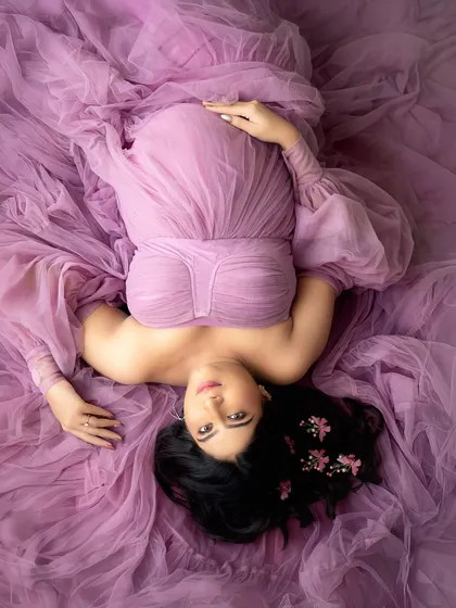 Your maternity session is a chance to feel like a queen. This artistic top-down portrait shows how we can play with perspective and colour, using one of the many glamorous gowns available in my studio wardrobe to create something truly unique.