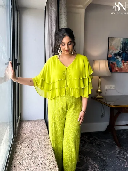 Another angle of the Indo-Western Mehendi look, showing how the soft hair balances the structured outfit.