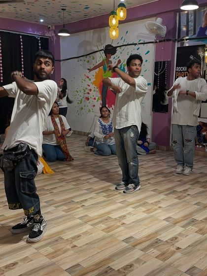 Our instructors leading the Holi workshop. Even in practice, the festive energy is high.