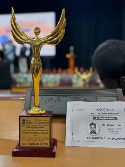 The trophy and certificate for the Best Coach Award. This isn't just for me; it's for every player, parent, and supporter of IB Sports Academy.