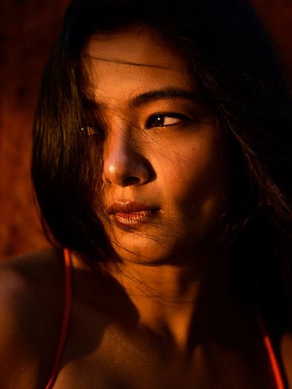 A more pensive moment from the "Summer was Summering" series. The model looks away from the camera, and the harsh light catches the side of her face, creating a beautiful, high-contrast profile that feels both cinematic and intimate.