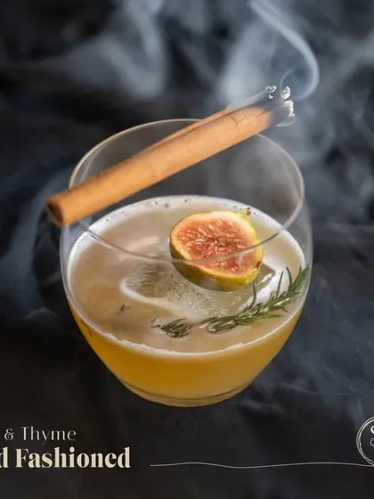 I give as much thought to my cocktails as I do to my food. This is my Fig & Thyme Old Fashioned, made with a house-made fig jam, pecan coffee bitters, and a smoked cinnamon stick for an aromatic, multi-sensory drink experience.