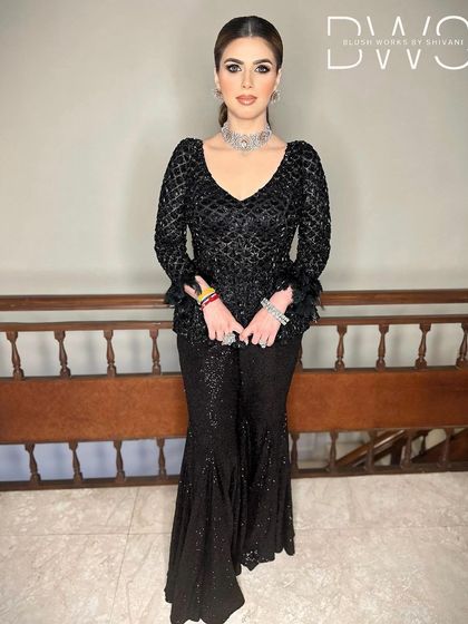 A full-length view of the client's reception look, with a sleek high ponytail that adds a touch of modern glamour.