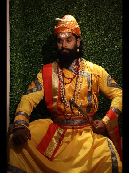 A full-length portrait capturing the traditional attire and regal pose of a model for a Shivaji Maharaj Jayanti photoshoot.