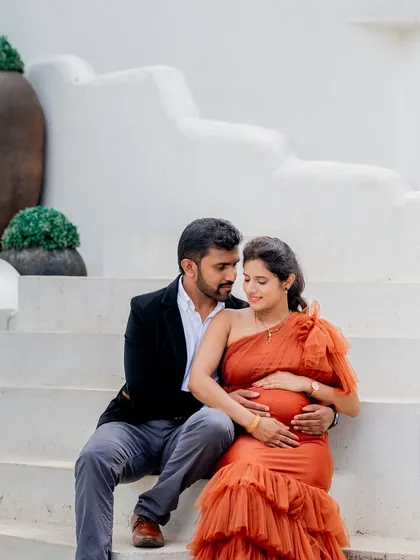 A beautiful couple's shot in our orange Bronze gown. The tiered mermaid-style skirt adds texture and drama, perfect for a Santorini-themed shoot.