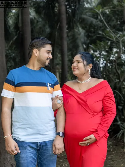 A simple walk in the park can create the most natural and loving portraits. The candid smiles and easy connection between this couple in their red and blue outfits make this a warm and authentic moment.