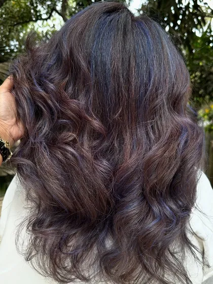 For my experimental clients like Bhakti, we love to play. This time we went for a cool purple and blue mix on her curly hair. The color looks so different after a few washes, fading into a beautiful pastel tone.