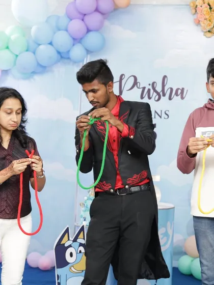 My magic isn't just for kids. I love getting everyone involved, from children to adults. This interactive rope trick at a family birthday party had everyone guessing and smiling.