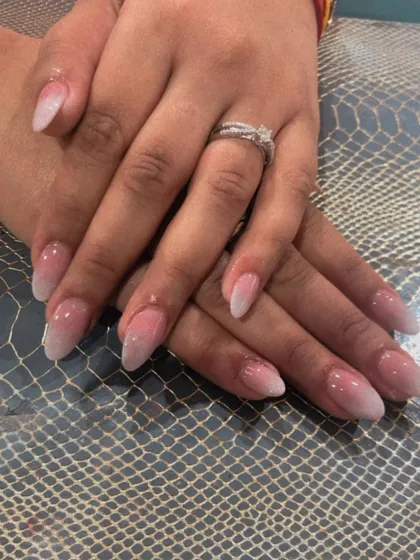 A full view of the classic pink and white ombre nails.