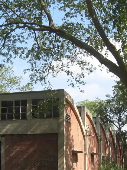 Before the transformation, this was the industrial shed in Okhla. We saw the potential in its strong architectural bones and brick arches, choosing to work with the existing structure as a foundation for a new, environmentally-conscious design.