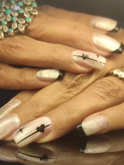 Another angle of the edgy French manicure, showing the combination of different minimalist designs.