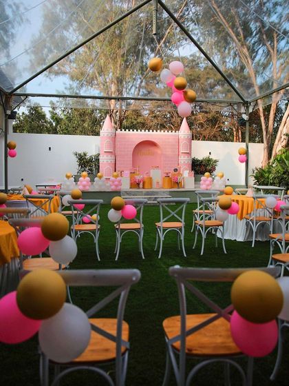 A wide shot of a princess-themed birthday party at The Backyard. The setup includes guest seating and a beautifully decorated stage, all ready for a royal celebration.