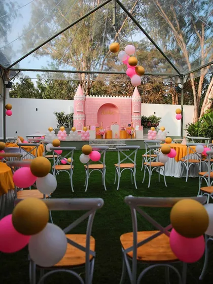A wide shot of a princess-themed birthday party at The Backyard. The setup includes guest seating and a beautifully decorated stage, all ready for a royal celebration.