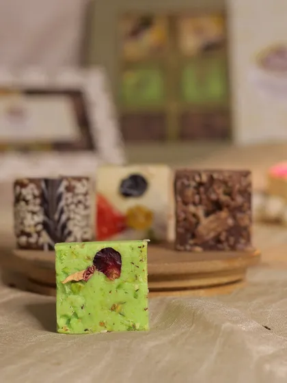 A close-up of our unique Pista Kunafa fudge, one of four special flavors including Dates & Peanut, Candied Fruit, and Kit Kat.