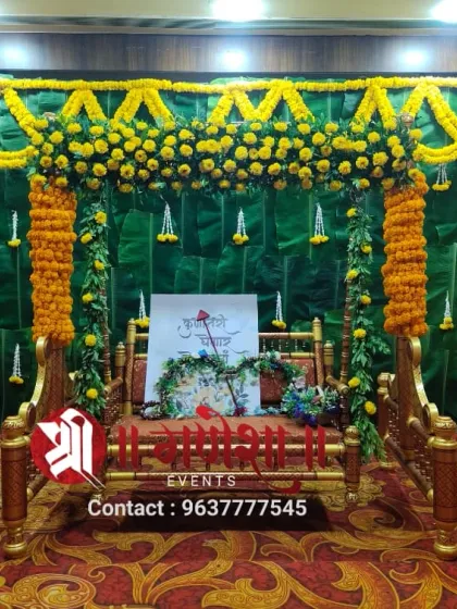 For families who love a traditional look, I design Dohale Jevan decorations like this one. The backdrop is made with real banana leaves and decorated with fresh marigold flowers for an authentic feel.