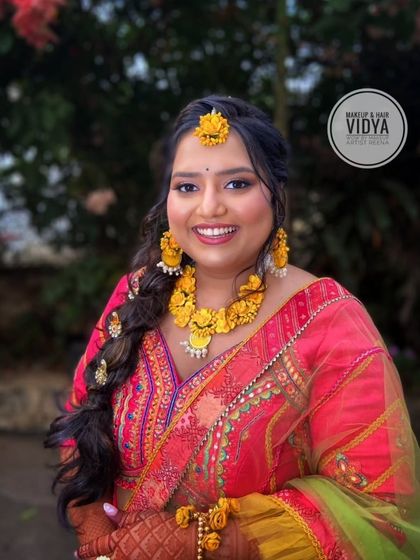 A beautiful haldi look for Srishti. My artist Vidya created a colorful and festive look with a pink and yellow outfit and a lovely braided hairstyle.