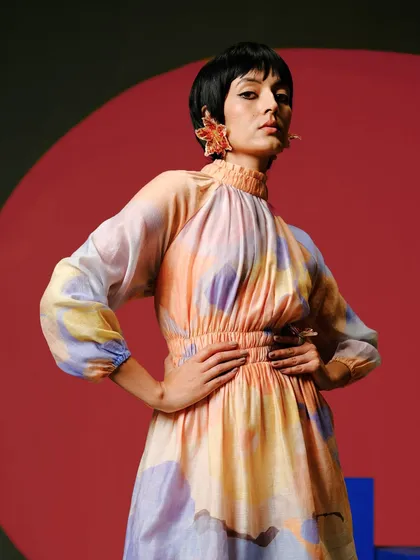 Effortless movement and modern flair define this watercolour-print dress. The fluid silhouette and high neckline make it a chic and comfortable choice for an evening out.