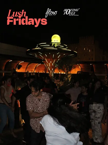 A wide shot capturing the scale of our Lush Friday event. The entire terrace is filled with people dancing and socializing, creating a lively and welcoming environment for everyone.