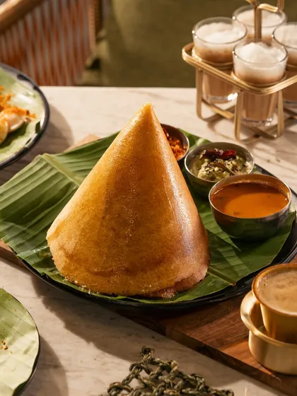 The iconic cone dosa, presented with its traditional accompaniments. I love shooting regional specialties, capturing their unique character and cultural significance.