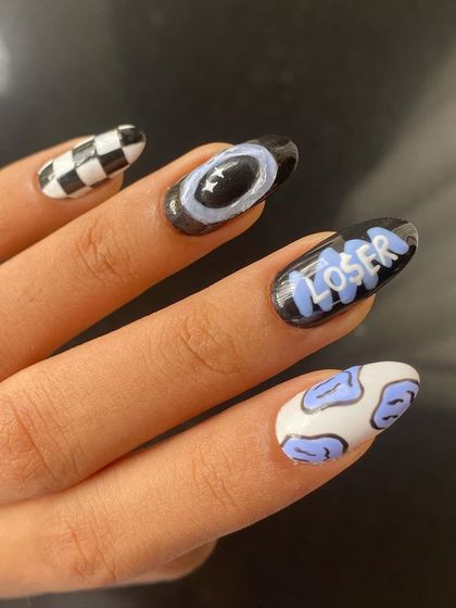 My recent favorite set. It combines a checkerboard nail, a "Loser" graphic, cow print, and a 3D orbit design for a cool, edgy vibe.