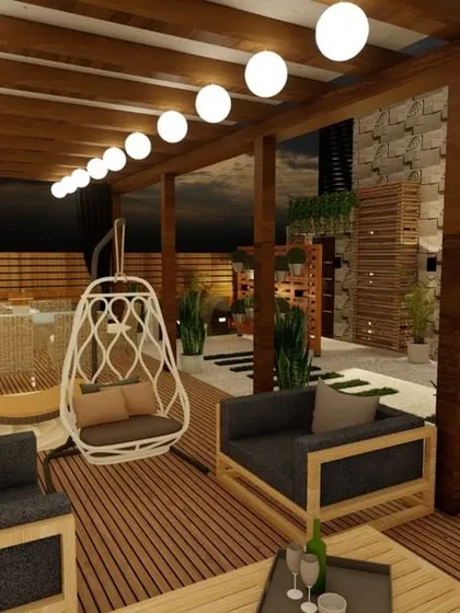 This expansive terrace design features a large pergola with string lights, creating a perfect space for parties and get-togethers. We included multiple seating zones, including sofas and swings, to accommodate large groups comfortably.