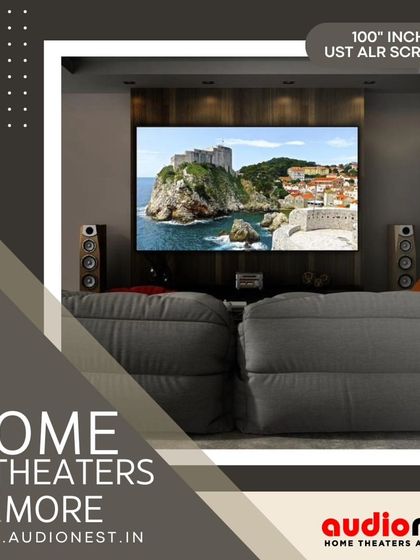 A 100 inch UST ALR screen paired with bookshelf speakers creates a big screen experience without a dedicated theater room. The beanbag-style seating adds to the relaxed, modern vibe of this media space.
