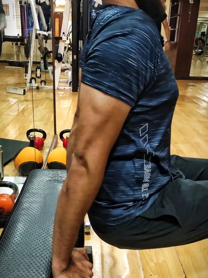 The result of consistent tricep work. This is my client's arm after just two weeks of focused training on dips and other exercises.