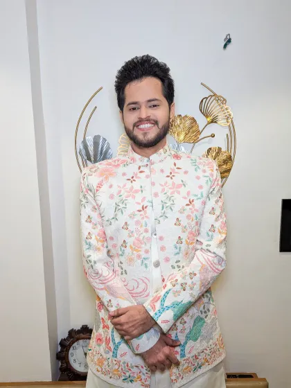 Another look at this unique sherwani, which features beautiful butterfly and bird embroidery. A truly one-of-a-kind look.