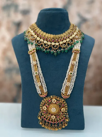 A close-up view of the magnificent bridal set we created by combining heirlooms from both the bride's Dadi and Nani. The detail shows how we blend different styles into one cohesive, stunning piece.