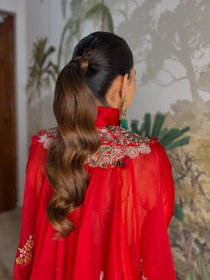 A close-up of the perfectly styled wavy ponytail.