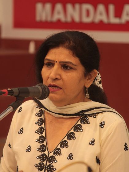 A senior member of our Gurukul sharing her devotional music with the audience.