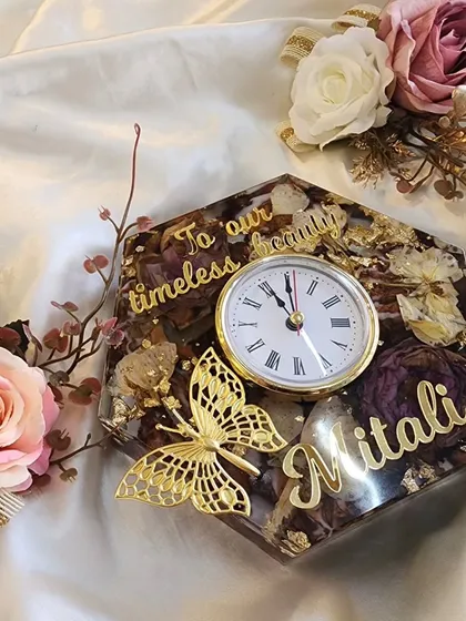 Another view of this beautiful floral table clock, surrounded by flowers. It's a piece that truly brings the garden inside.