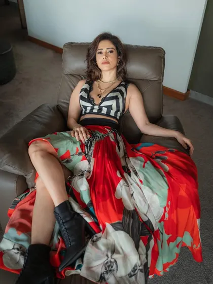 Ready for a pool party! I styled Nushrratt Bharuccha in this edgy look, pairing a bold floral skirt with a striped crop top and combat boots for a fun, high-fashion contrast.