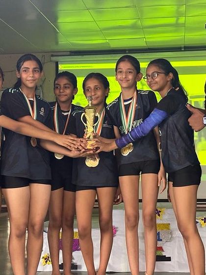 Our Level 4 Girls team with their Best Team award and their coach. A proud moment for everyone.